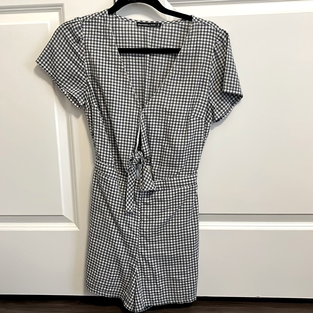 Blue and white gingham romper with a cutout in the center